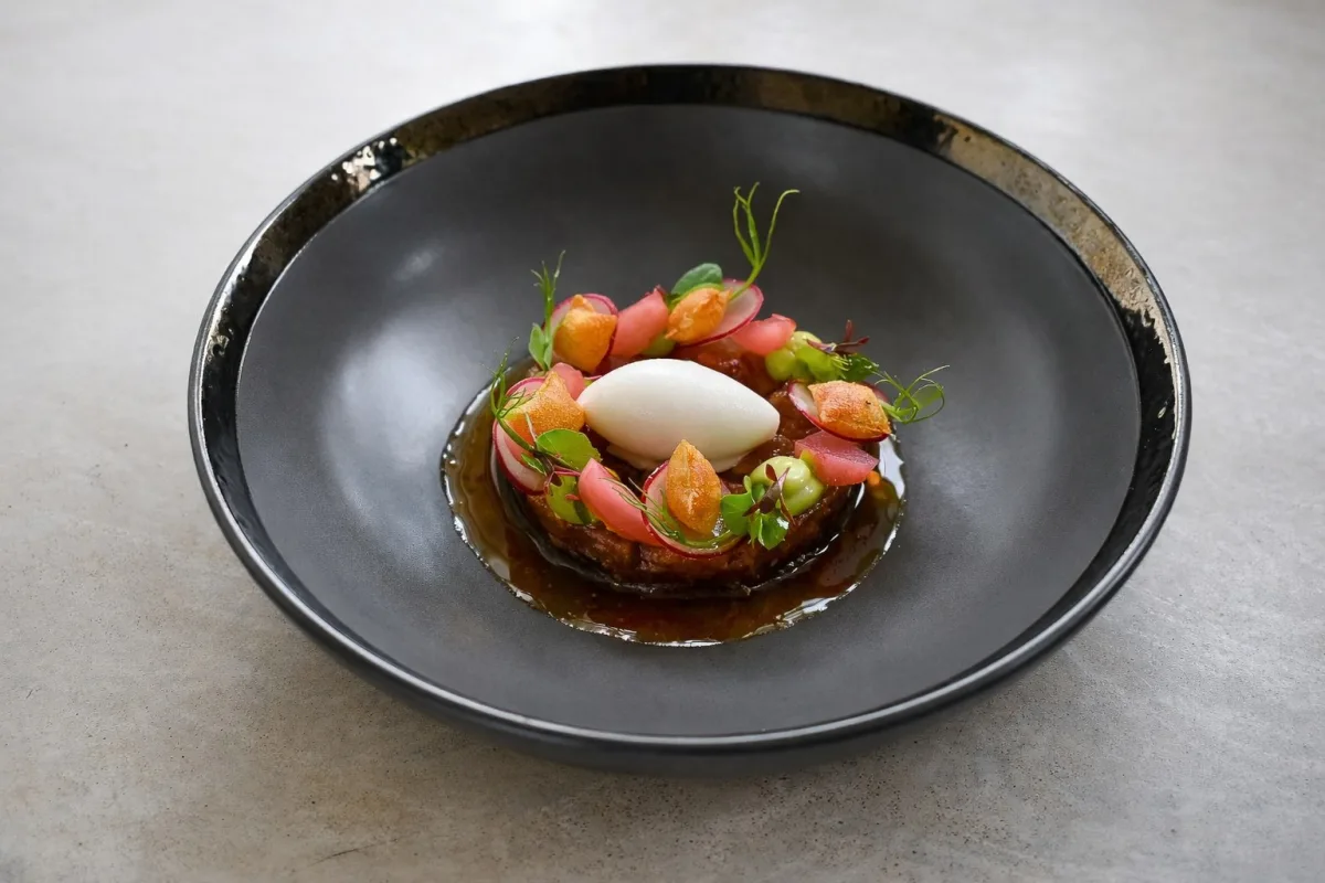 A refined plated course by Chef Robin Housen
